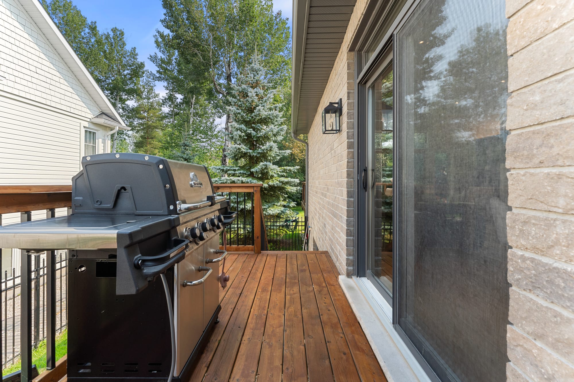 Built-in gas barbecue on the cedar deck beside the sliding doors to the great room